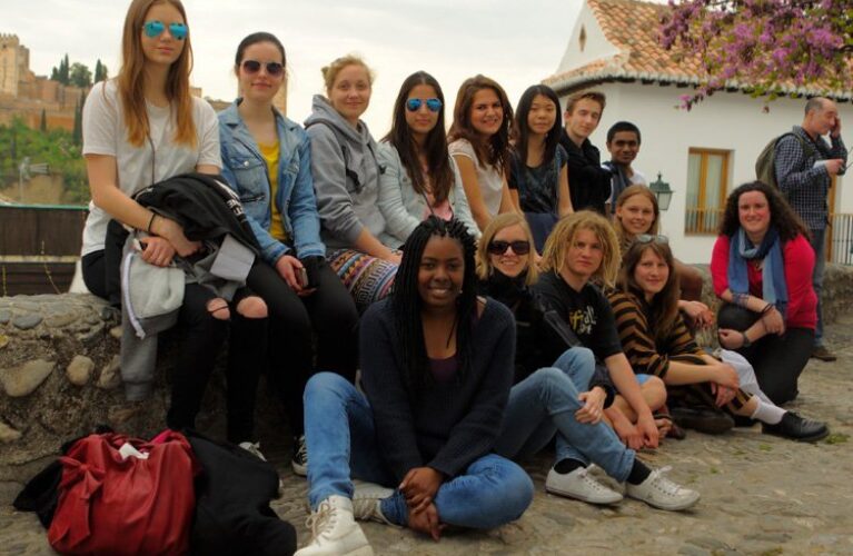 Group of students at the side of a road in Spain
